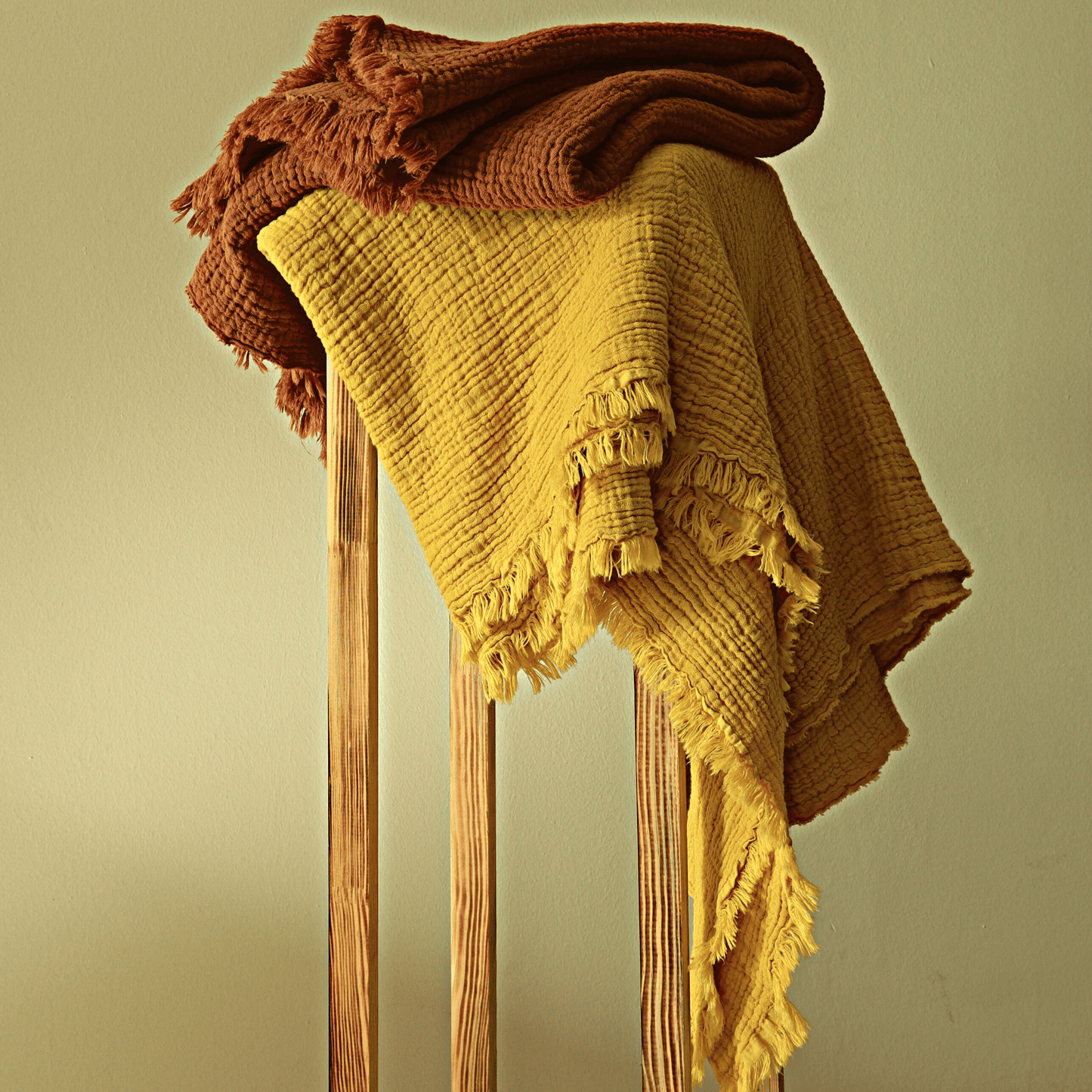 Rust Muslin Throw Blankets
