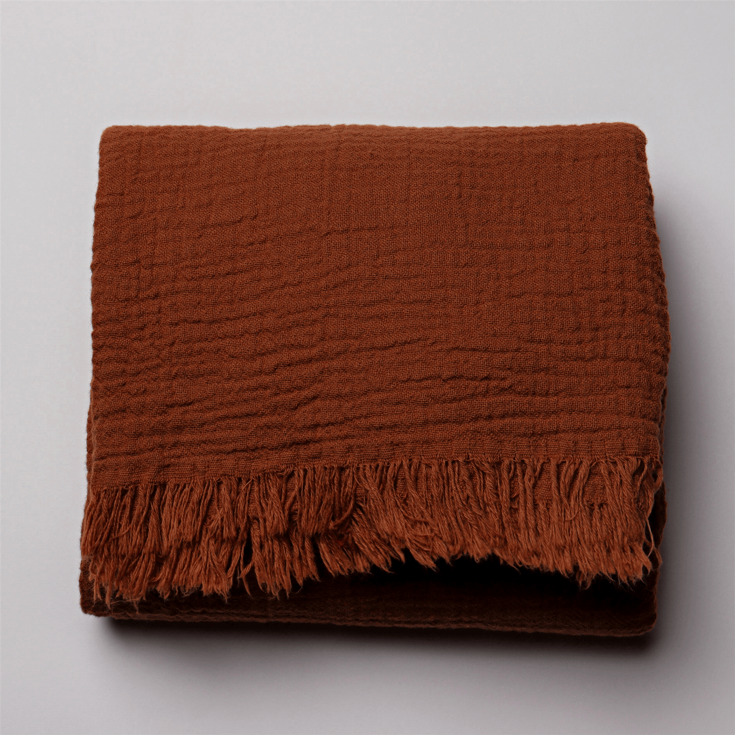 Rust Muslin Throw Blankets
